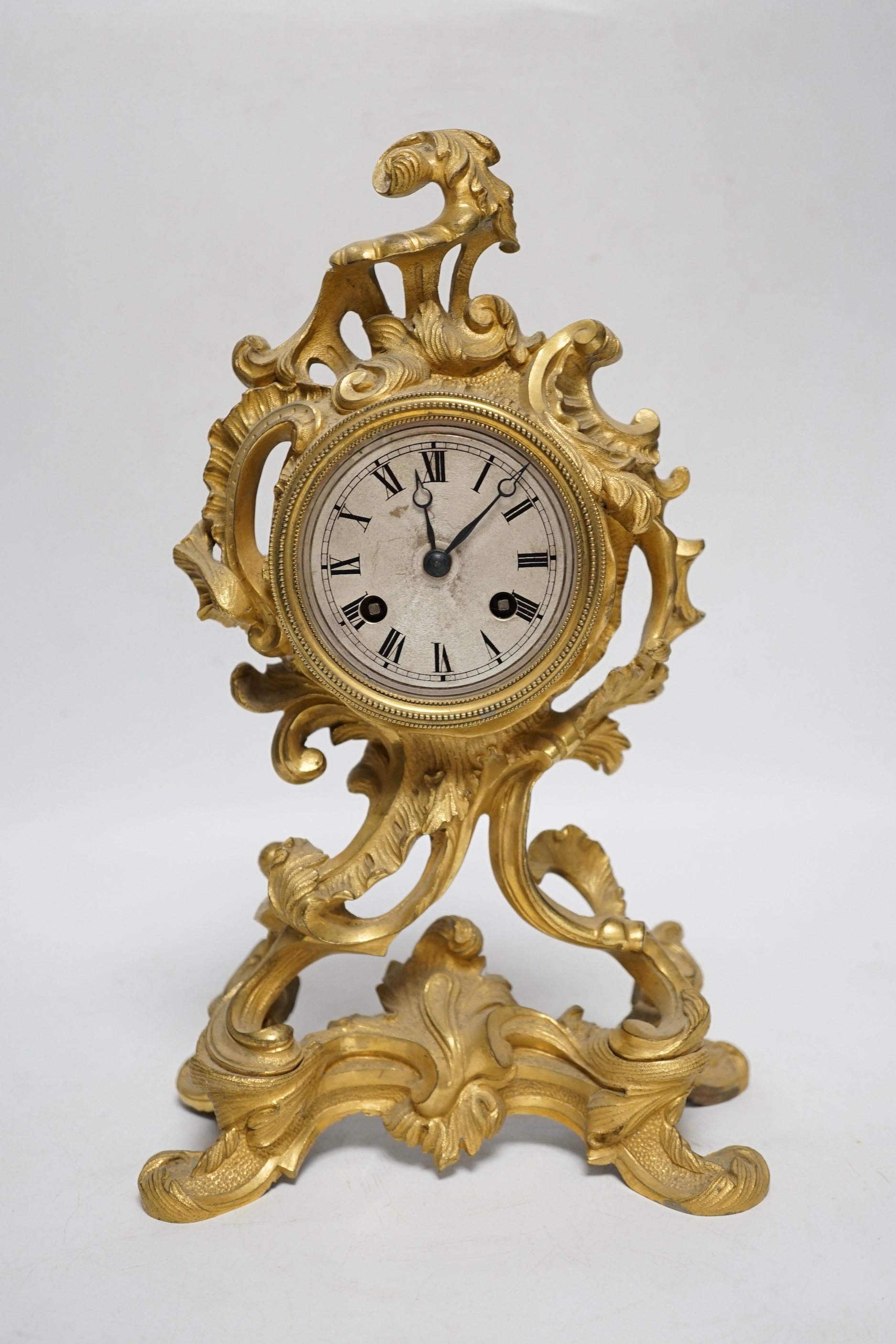 A 19th century French rococo-style ormolu mantel clock with Raingo movement striking on a bell (missing pendulum), 29cm